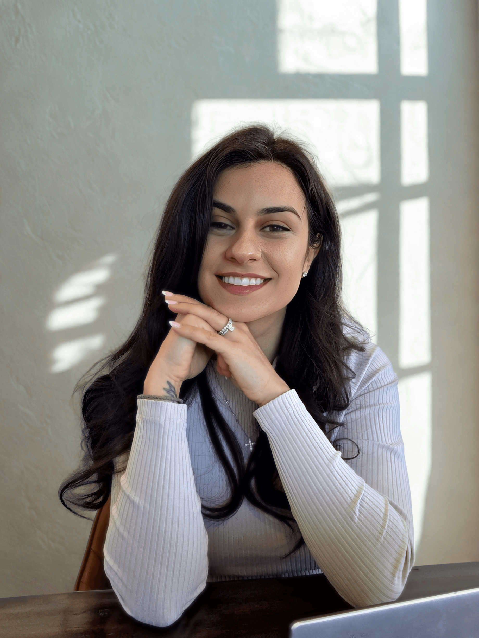 Psychologist Nasia Outsikas Smiling in Office
